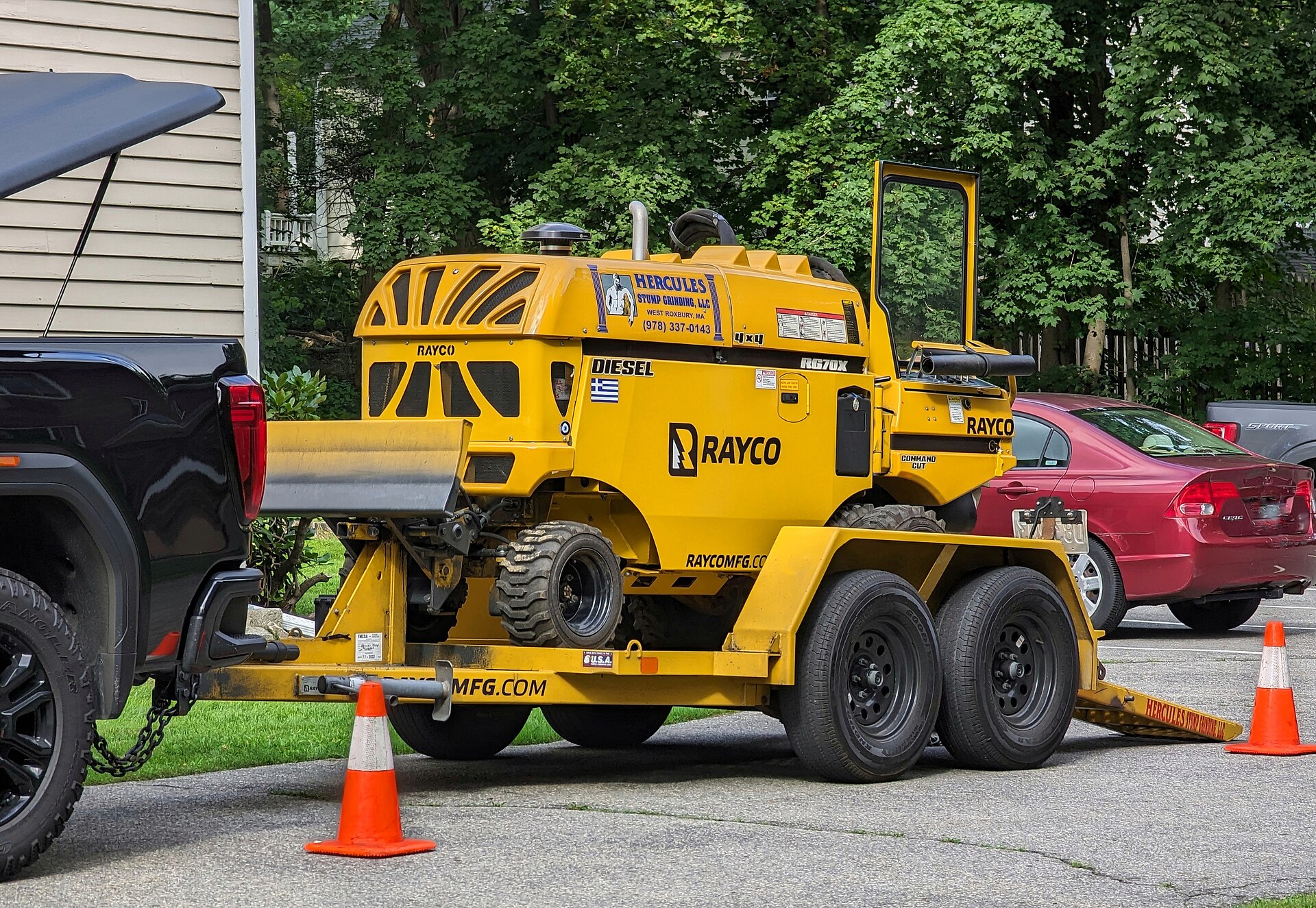 Rayco stump grinder on trailer in driveway
